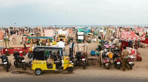 Rickshaw driver moves rickshaw with hands outside marina beach Stock Footage 65988407