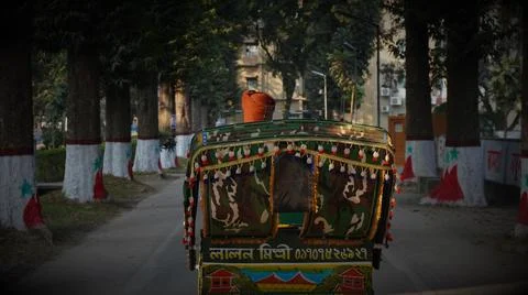 Rickshaw puller inside town road 写真素材