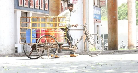 Rickshaw puller on the road Stock Footage 91535631