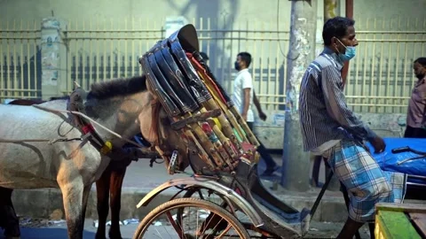Rickshaw Puller Waiting at Traffic Light in Dhaka, Bangladesh - July 17, 2024 Stock Footage 311187024