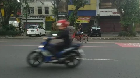 Rickshaw traversing the streets of Surakarta Stock Footage 270074893