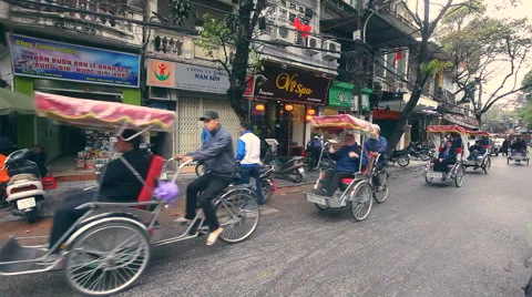 Rickshaws go one by one Hanoi capital city of Vietnam way Stock Footage 47952348