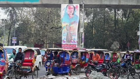 Rickshaws Queue Beneath Defaced Sheikh Hasina Mural Dhaka Flyover Pillar Stock Footage 339222018