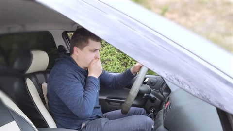 A ride during a car trip. The driver suffers from kinetosis, motion sickness. Th Stock Footage 128956471