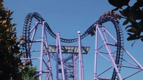 Ride on a heart shaped roller coaster on bright blue sky background Stock Footage 155395239
