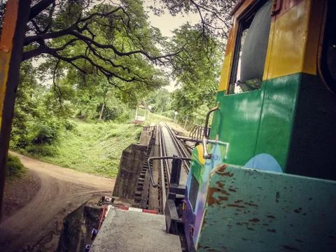 Ride a local old train over a small bridge in Thailand 写真素材