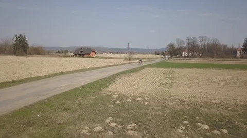 Ride on a moped among the fields Stock Footage 123522109