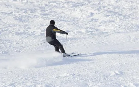 The ride from the mountain on skis, sporting events skiing. Stock Photos