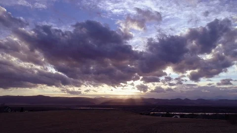 Ride over hill sunset clouds rays of light Stock Footage 73503102
