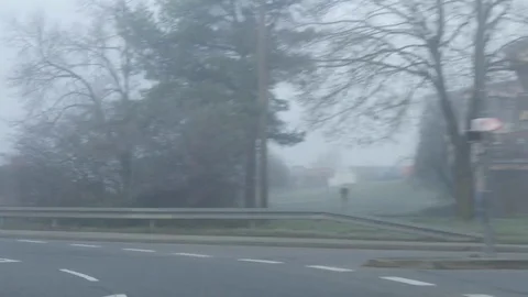 Ride on the road through place in heavy fog Stock Footage 82751153