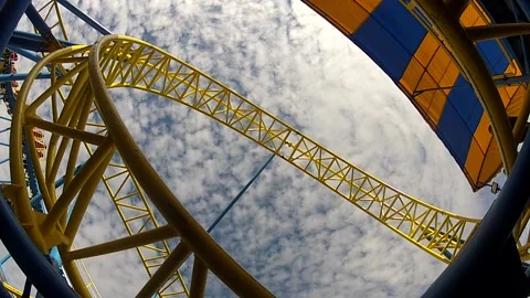 Ride on roller coaster in amusement park Stock Footage 164178693