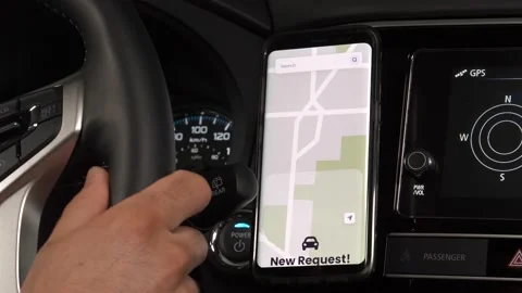 Ride Sharing Driver Receiving a New Request on His Smartphone Stock Footage 135099180