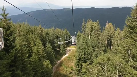 A ride through bulgarian pine forest on chair lift Stock Footage 135273308