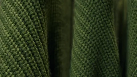 A ride through sweaters and clothes on hangers in a clothing store, close-up Stock Footage 267625966