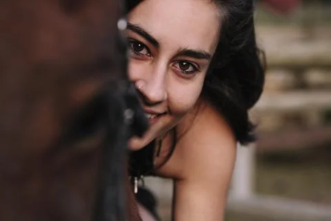 Rider girl looking at camera while hugging her horse. Stock Photos