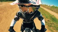 A Rider Jumps, Making Stunts On A Sandy Track. Pov Action Camera Shot. Stock Footage