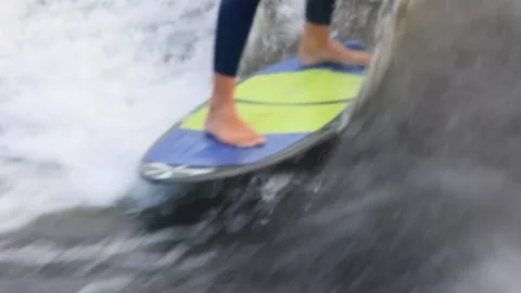 Rider performs stunts wakesurfing at high speed on waves Stock Footage 164040239