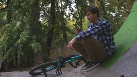 Rider is resting in the park Stock Footage 81231924