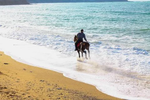 Rider on a sandy beach Foto stock