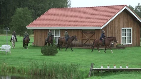 Riders arrive at the farm Stock Footage 237782747