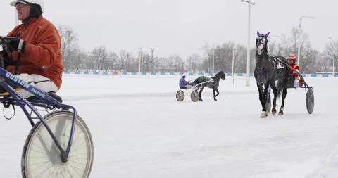 Riders during snowfall at drawing of winter traditional prizes for Oryol Stock Footage 276364608