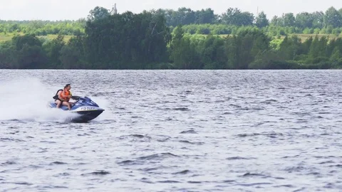 Riders on jet ski on lake. Stock Footage 79637697