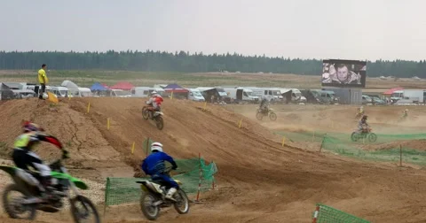 Riders on motocross competitions doing steep turns Stock Footage 65482288