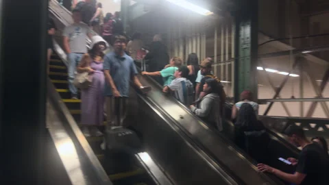 Riders on Side-by-Side Up and Down Escalators in Times Square-42nd St Station Stock-Footage 347924719