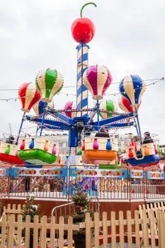 The rides at the fair on red square. Stock Photos
