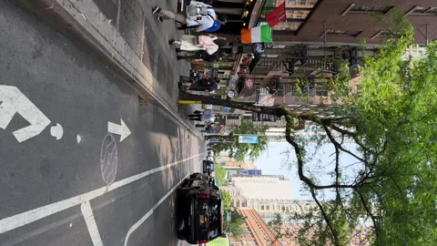 Riding along bicycle line in Hell's Kitchen neighborhood. Restaurants along road Stockbeeldmateriaal 242703281