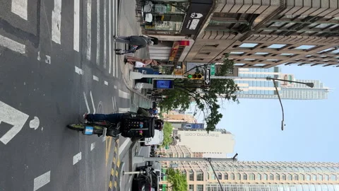 Riding along bicycle line in Hell's Kitchen neighborhood. Restaurants along road Stockbeeldmateriaal 242703412