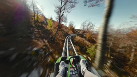 Riding on Alpine roller coaster in Montenegro Stock Footage 305771473