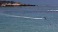 Riding on aquabike in Mediterranean sea in Coral Bay resort, Paphos, Cyprus HD Footage