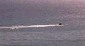 Riding aquabike in sunset sea HD Footage