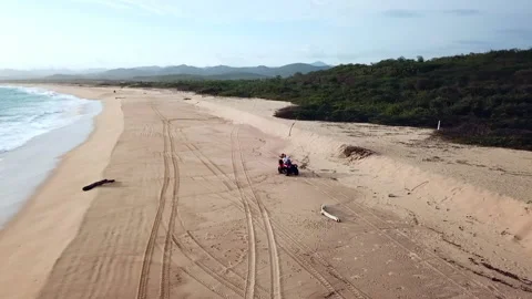 Riding an ATV on a beach in Mexico Stock Footage 199808897