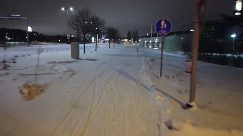 Riding bicycle along snowy route, Lappeenranta Finland Stock Footage 145309727