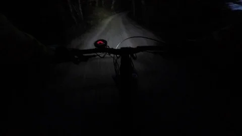Riding bicycle at night Stock Footage 82325113