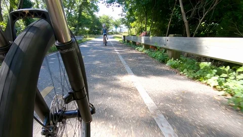 Riding bicycle outside Stock Footage 93117298