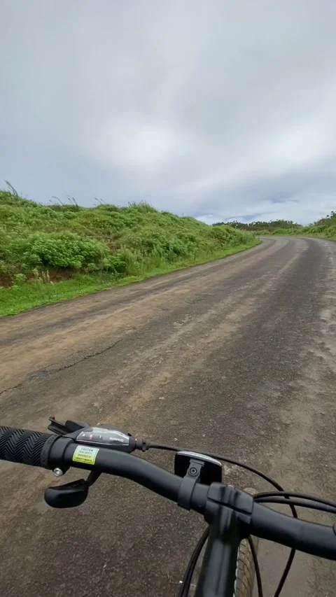 Riding a bike on a dirt road in Easter Island Stock Footage 342836162