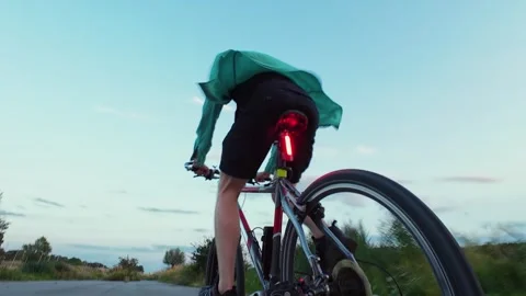 Riding a bike in the evening Stock Footage 314623393