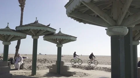 Riding Bikes Along the Coast Stock Footage 80165891