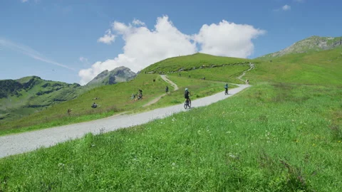 Riding bikes at Grindelwald First Stock Footage 219707750