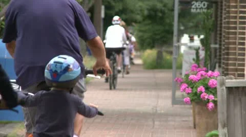 Riding bikes through town (4 of 7) Stock Footage 16708204