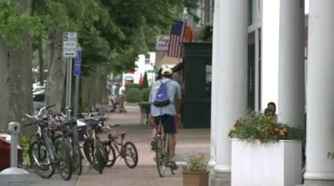 Riding bikes through town (5 of 7) Stock Footage 16708694