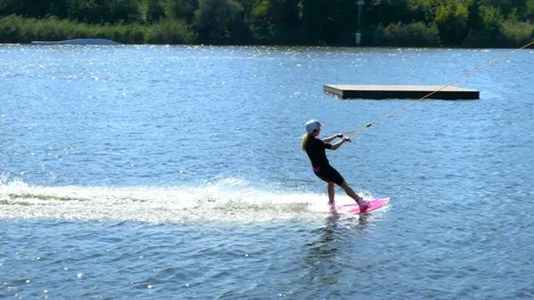 Riding a board on the waves Stock Footage 119892581