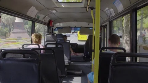 The riding bus with passengers and driver is counting money Stock Footage 78758832