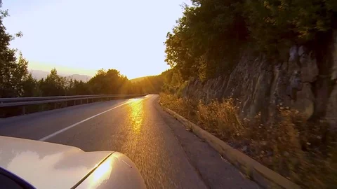 Riding a car at sunset 스톡 동영상 129111282