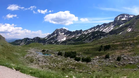 Riding on a car through mountain road in Durmitor park with extraordinary nat Stock Footage 190012534