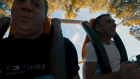 Riding on the carousel. Two men. Fear. Wheel. Upside down. Close-up. Slow motion 스톡 동영상 94197375