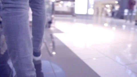 RIDING DOWN AN ESCALATOR Stock Footage 86083184